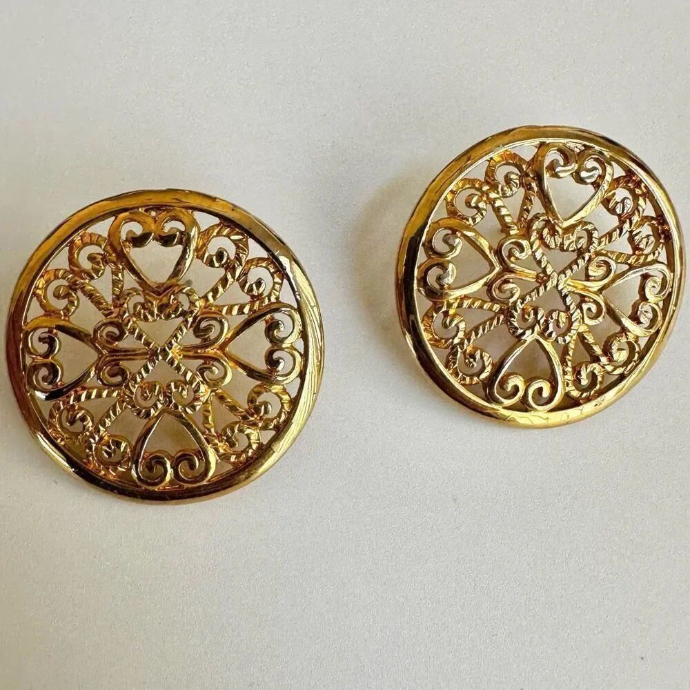 Gold tone round ornate post earrings
